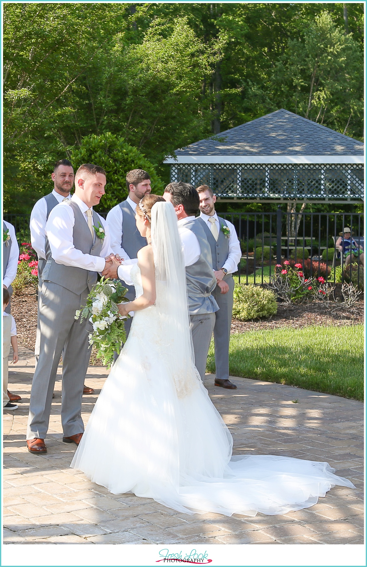 father handing off bride to groom