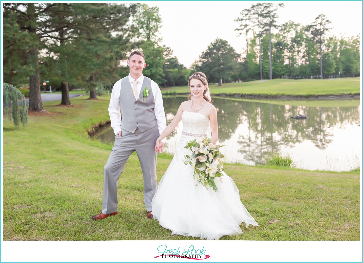 bride and groom by the lake