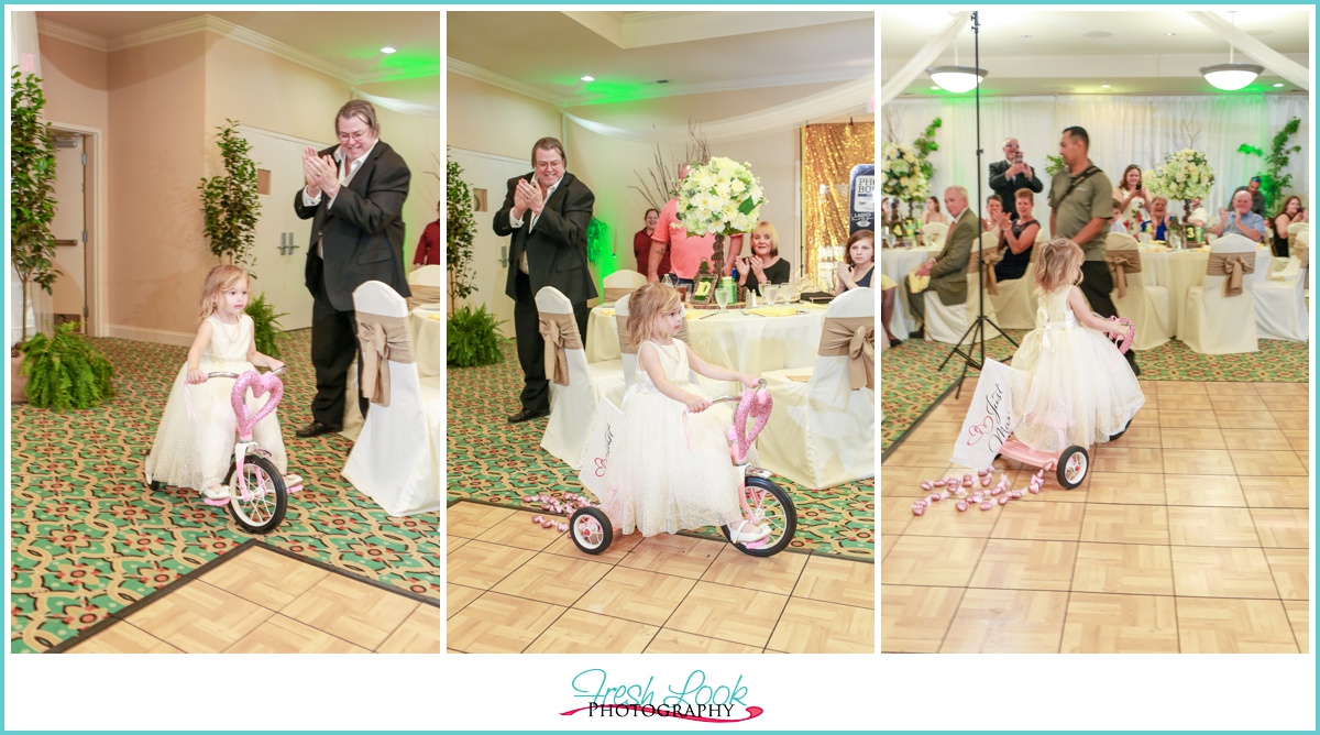 flower girl on trike at reception