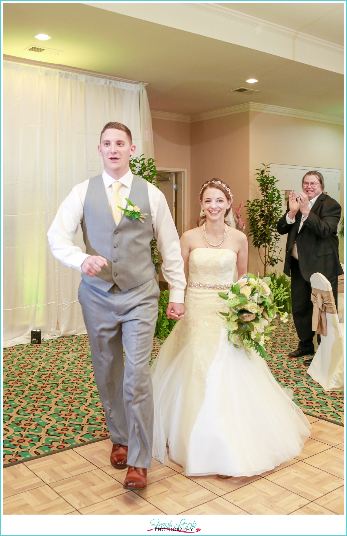 Bride and groom entering reception