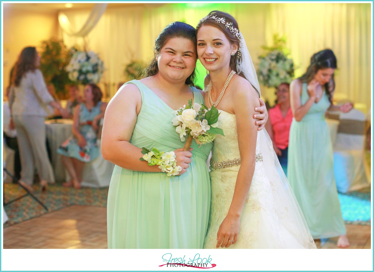 bridesmaid catching the bouquet