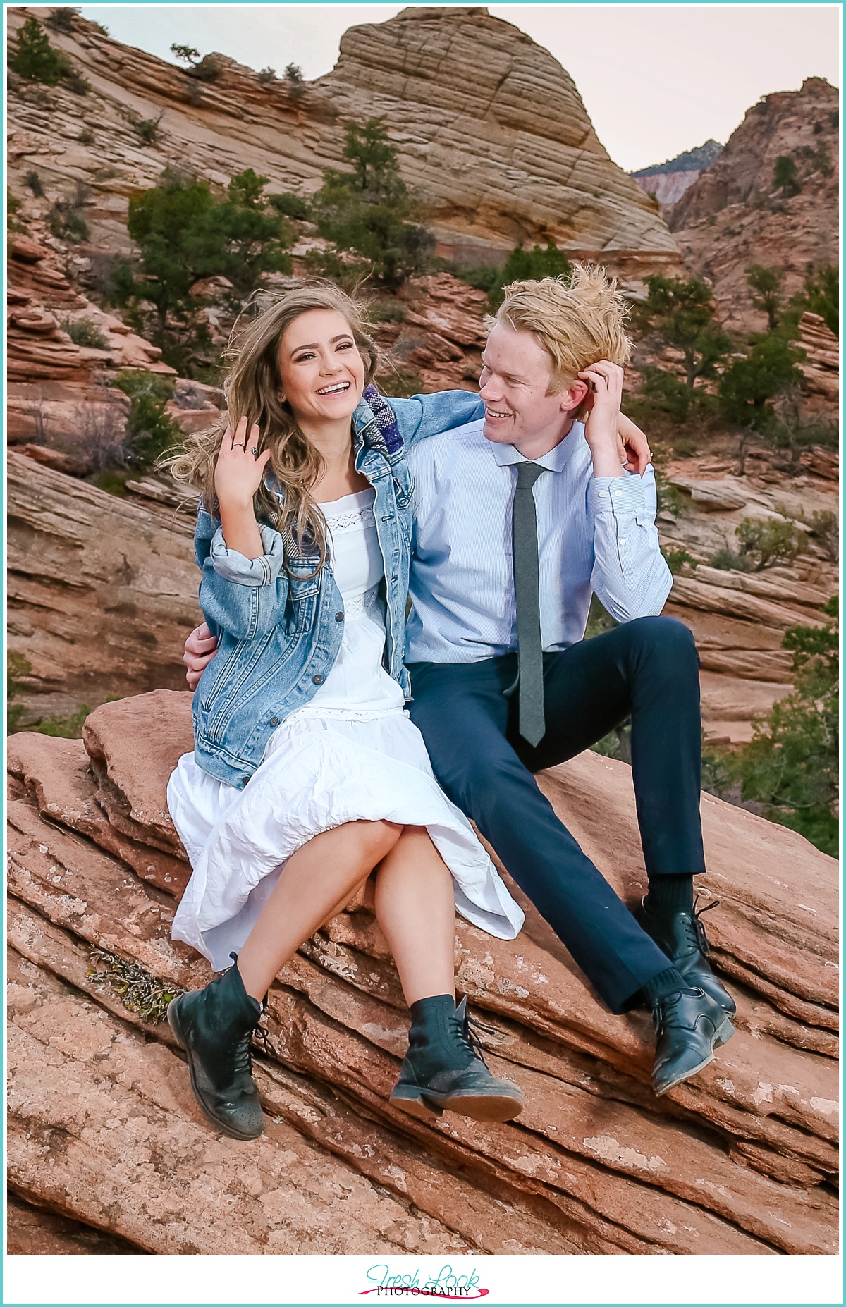 engaged couple laughing together