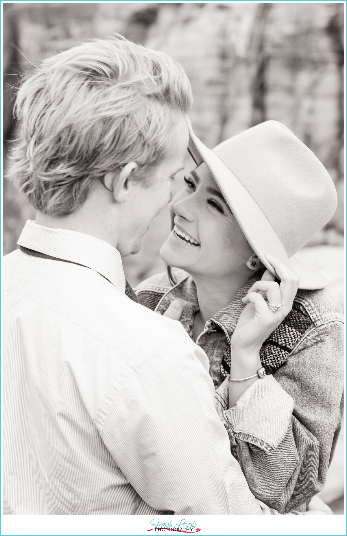 laughing together at engagement shoot