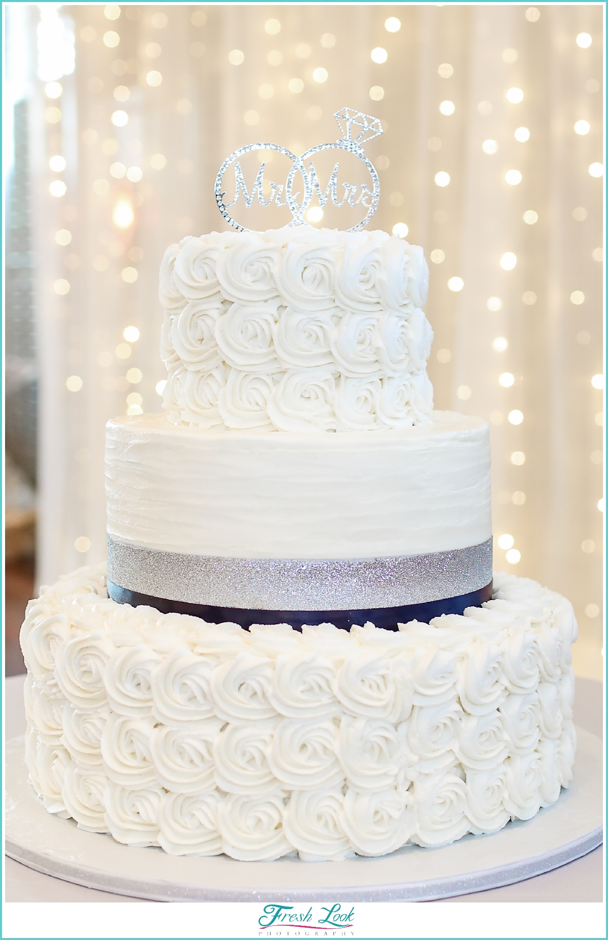 buttercream wedding cake and twinking lights