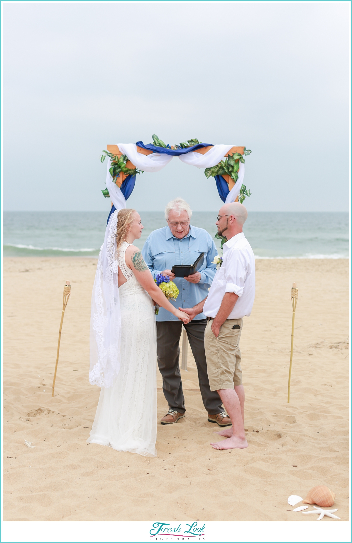 bride and groom at beach wedding