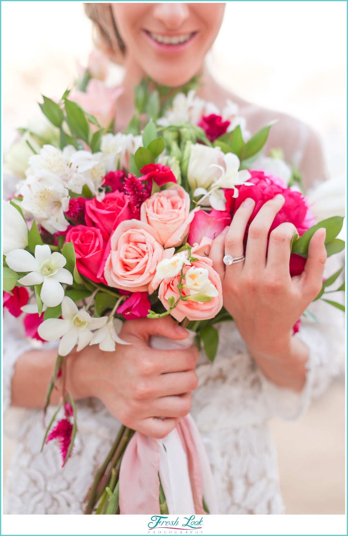 bride holding tropical bouquet