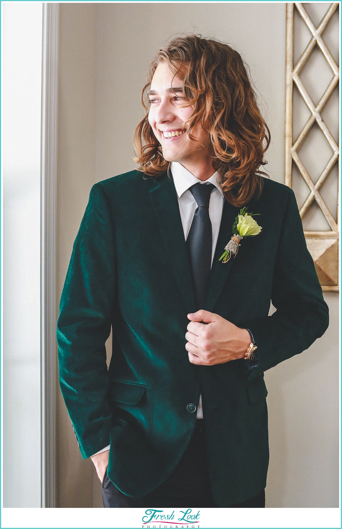 groom wearing emerald jacket
