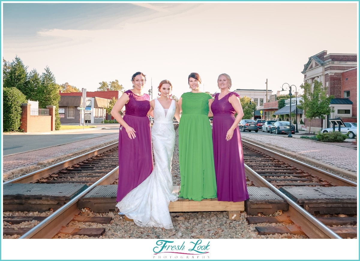bride and bridesmaids posing together