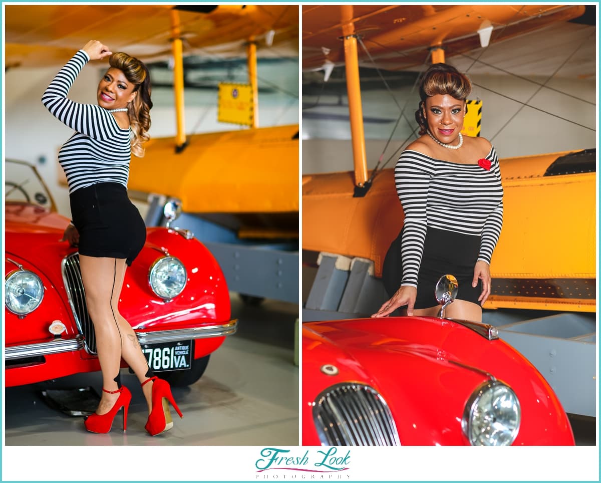 sexy fun pin up girl modeling with vintage car