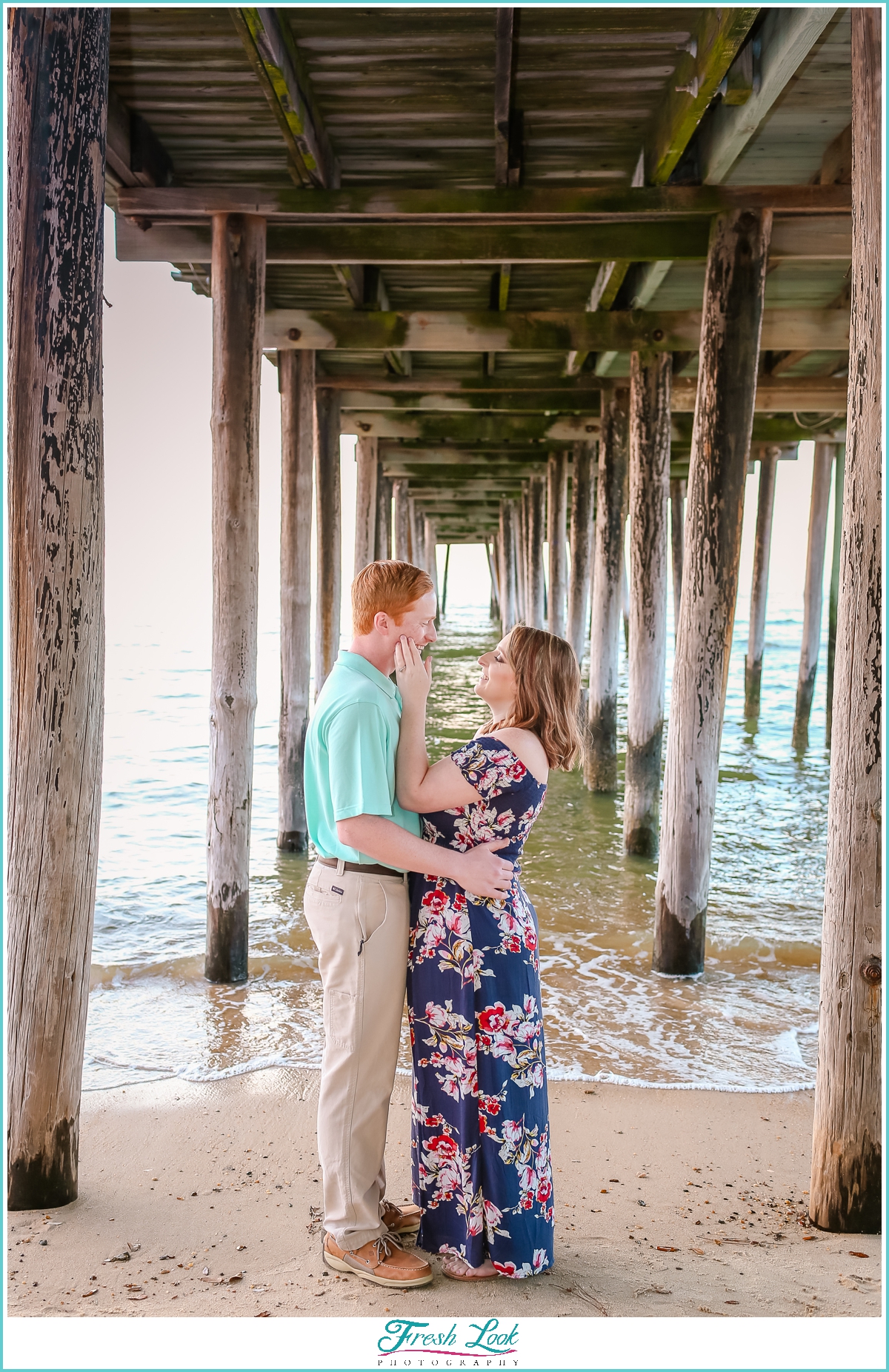romantic kiss under the pier