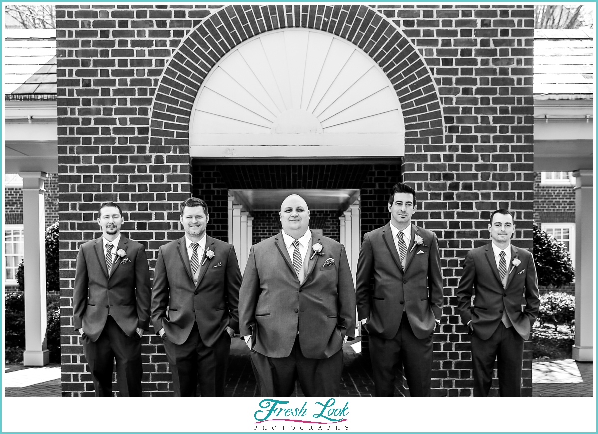 groom and groomsmen black and white photo