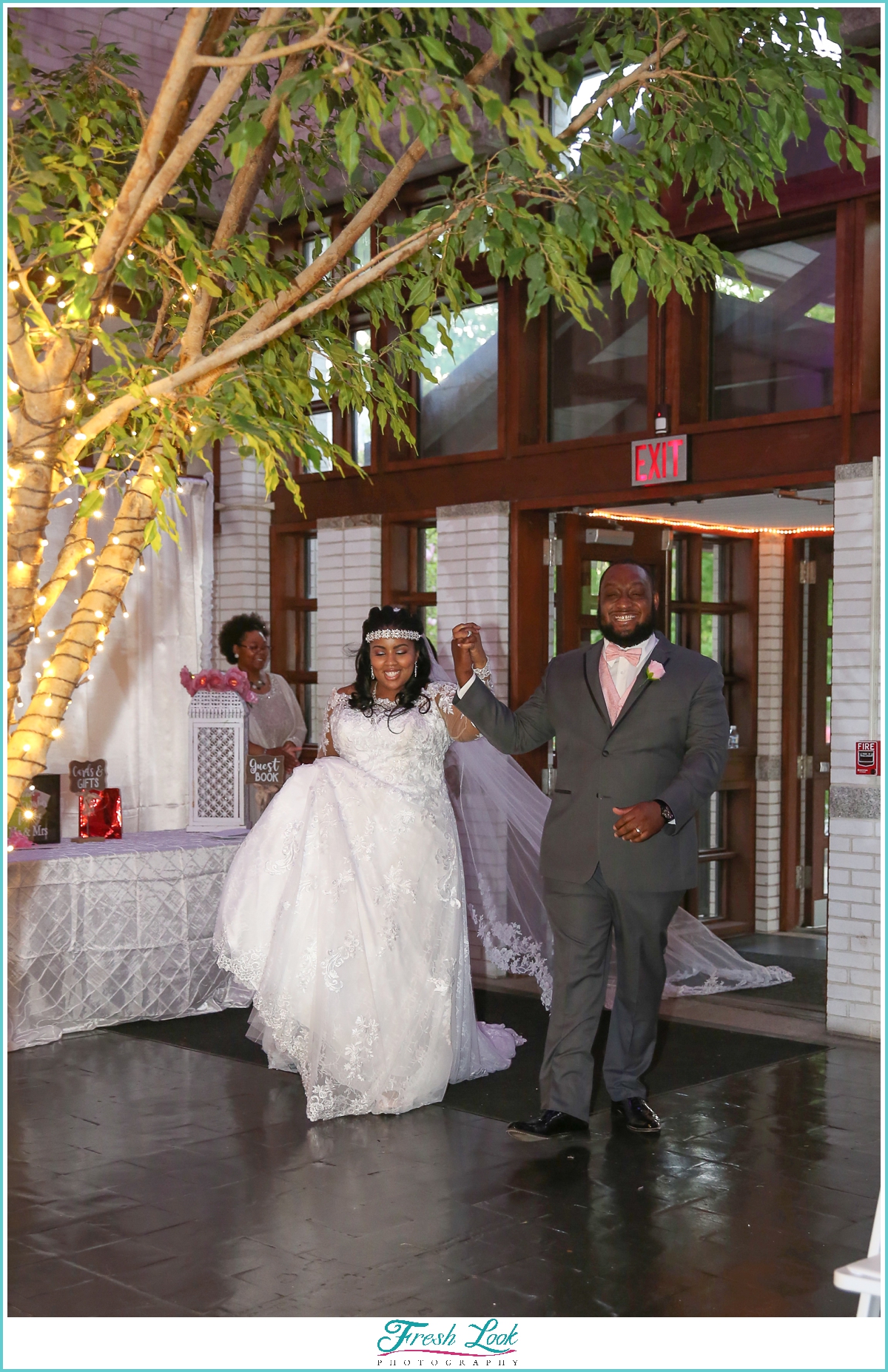 bride and groom entering reception