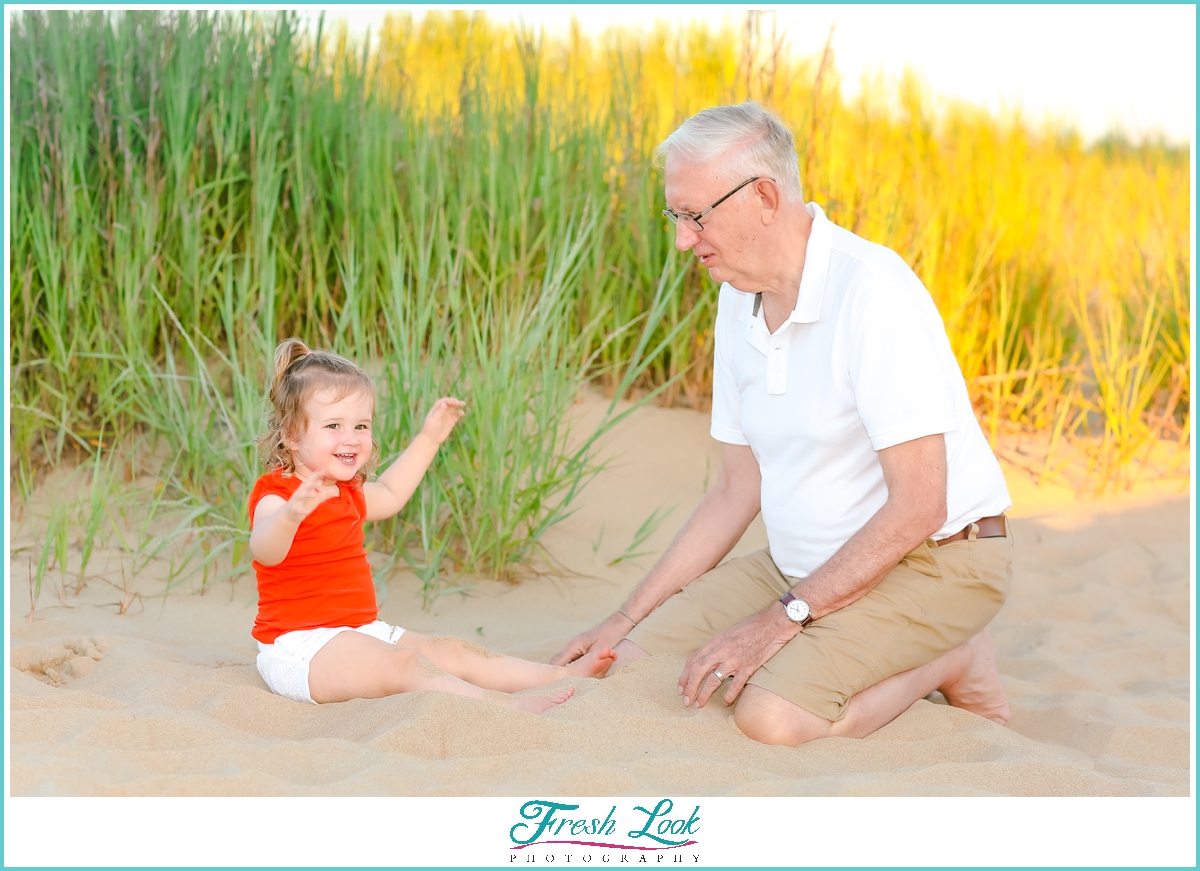 playing with grandpa in the sand