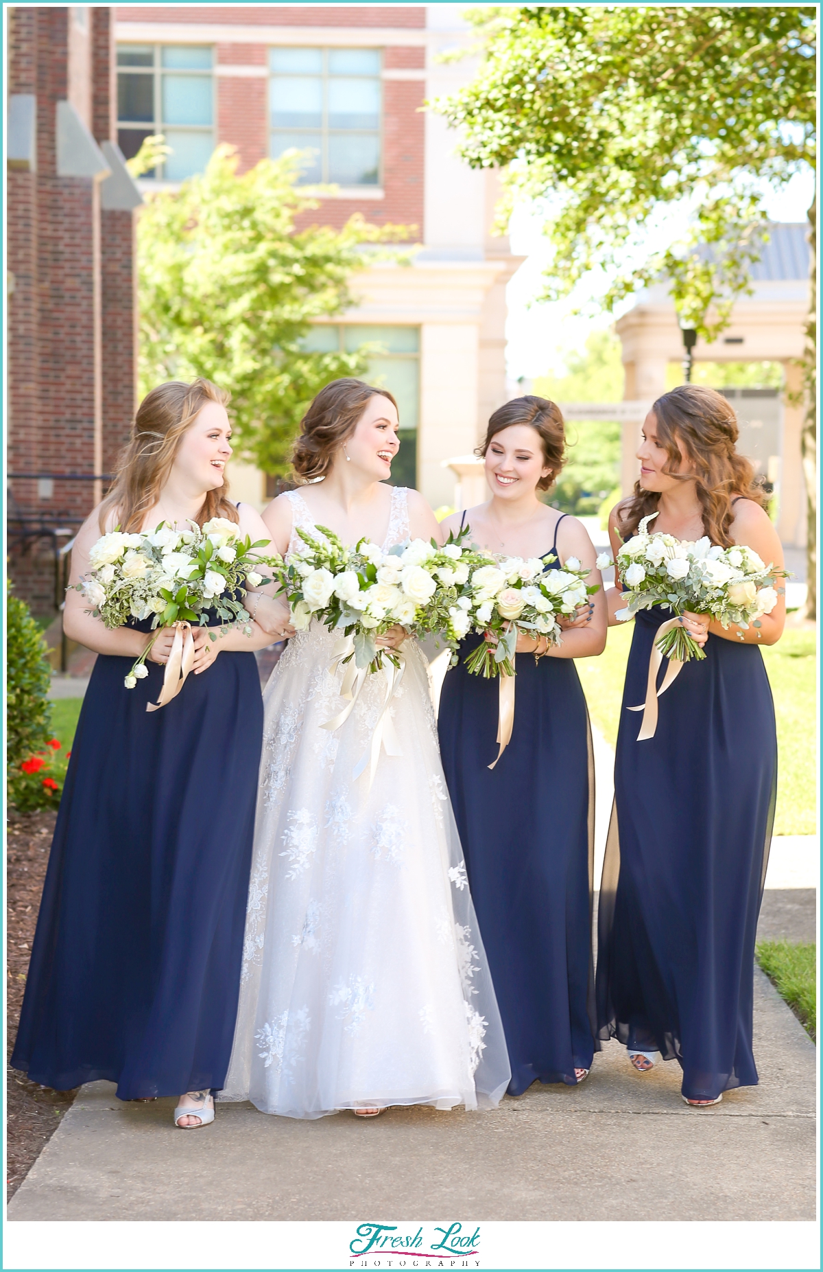 bridesmaids wearing navy blue dresses