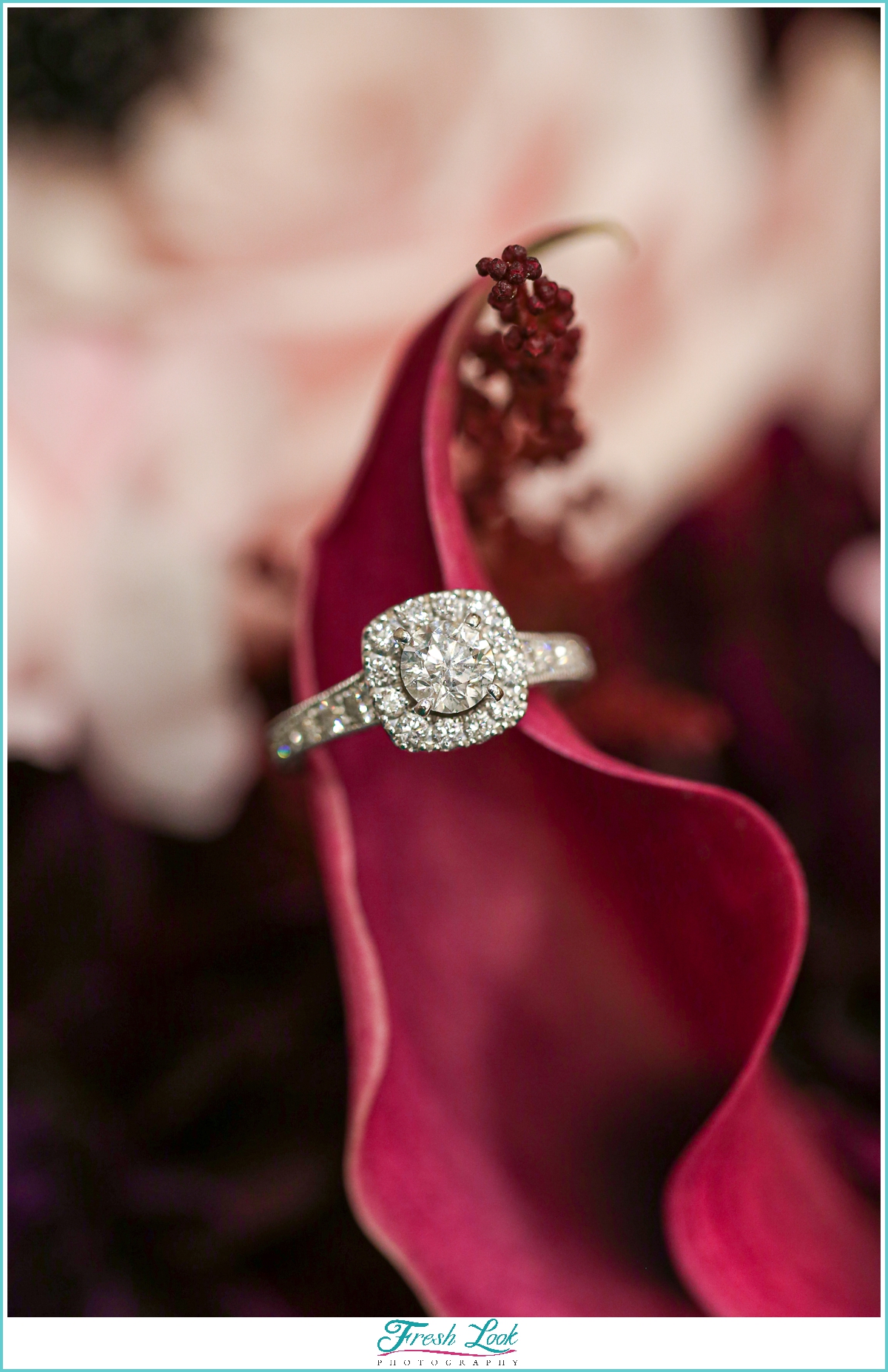 diamond engagement ring on flowers