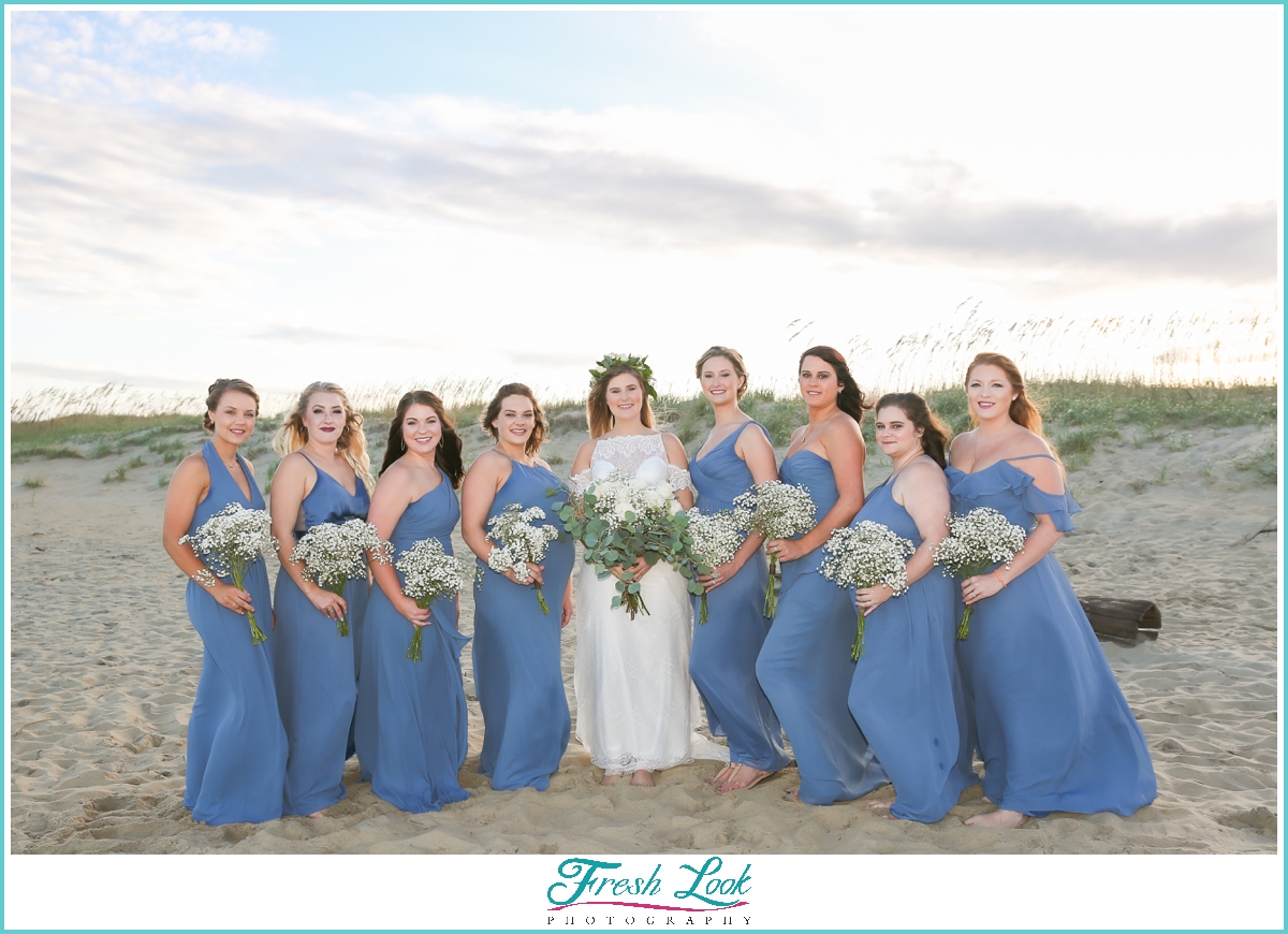 bride and bridesmaids on the beach