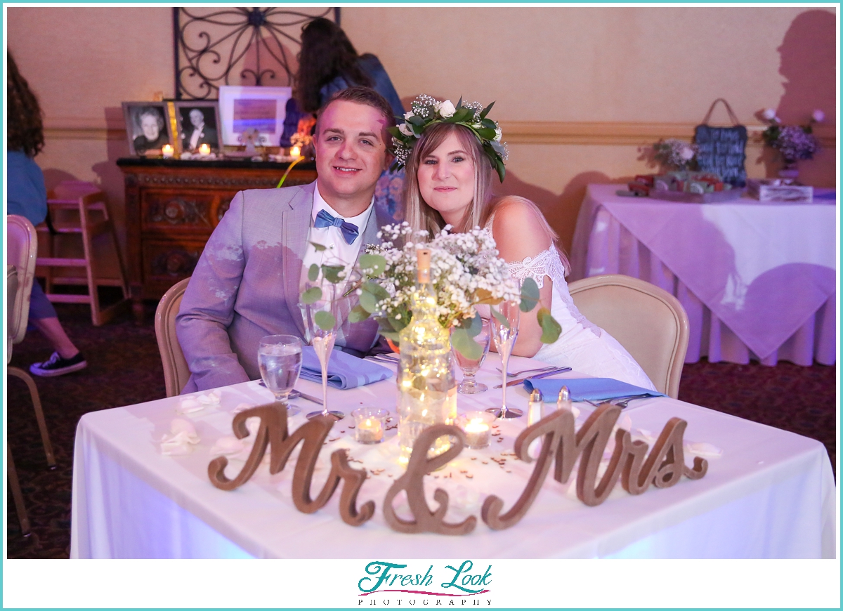 bride and groom at sweetheart table