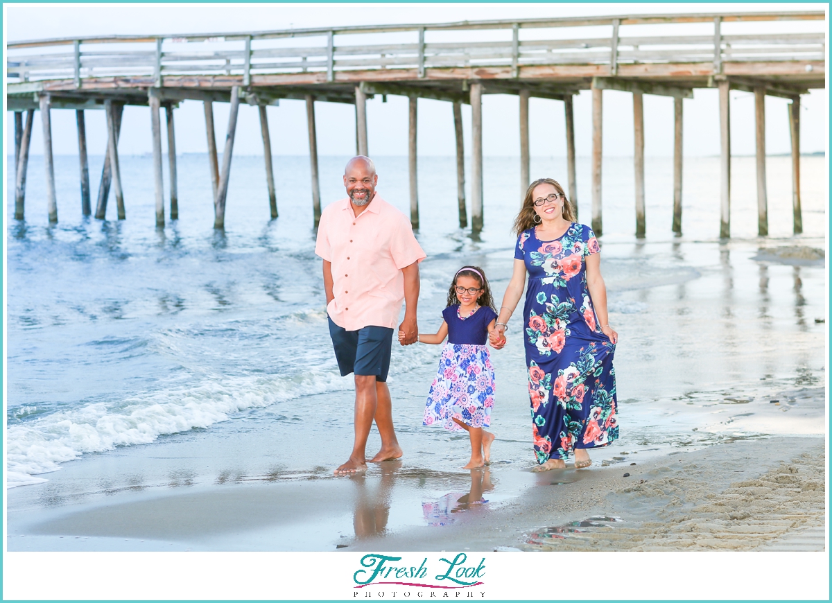 family walking on the beach during photoshoot