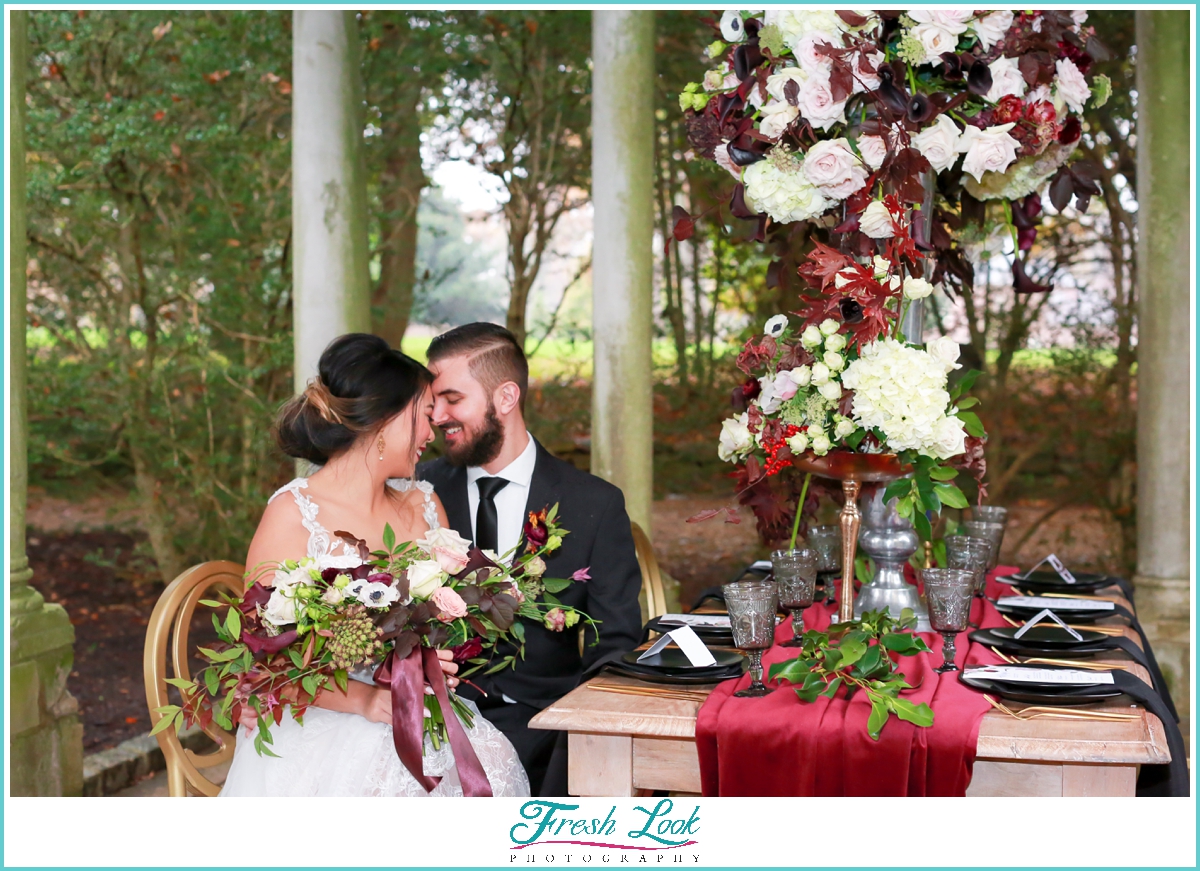 bride and groom snuggling during wedding reception