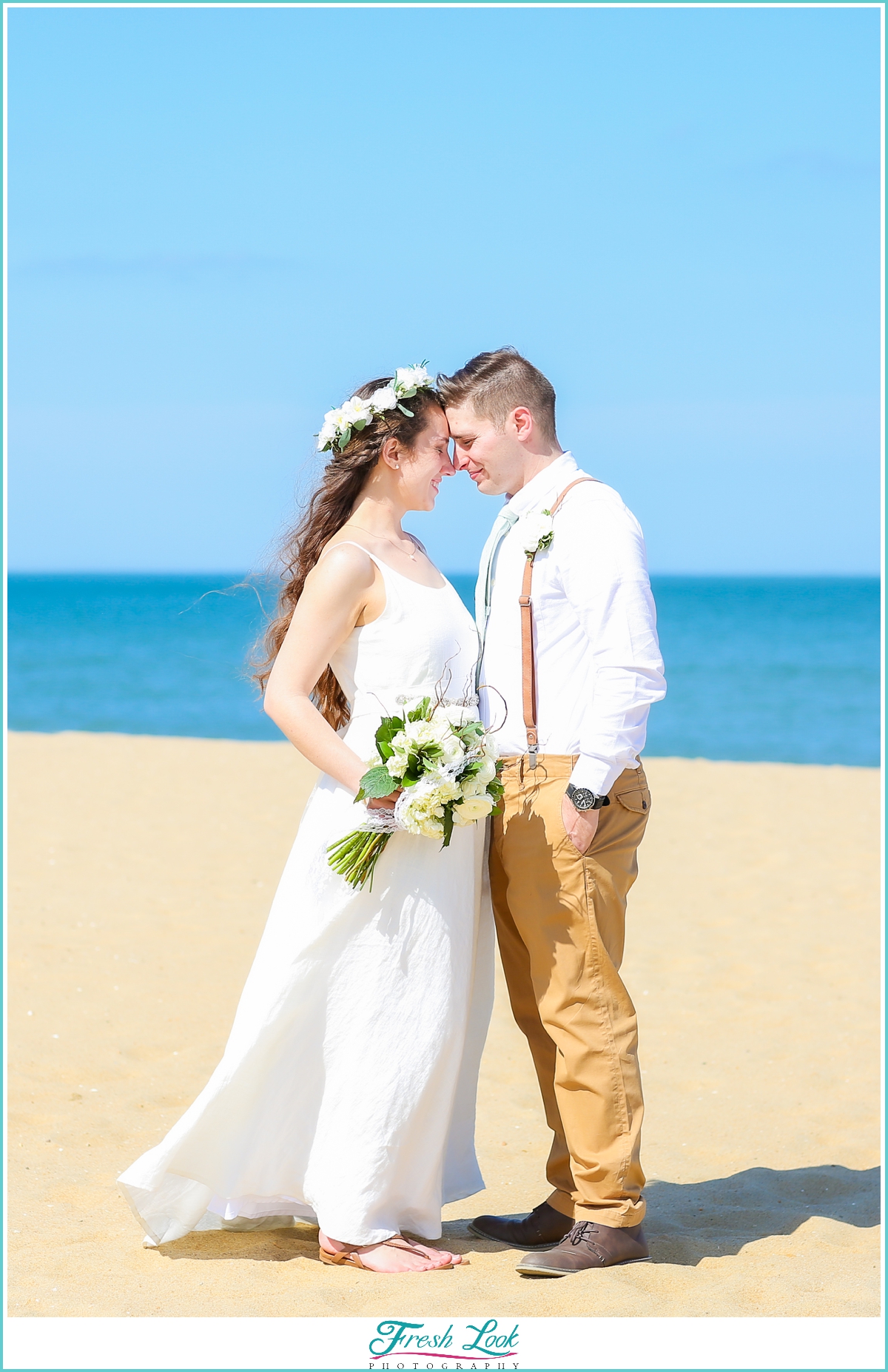 bride and groom on beach photoshoot