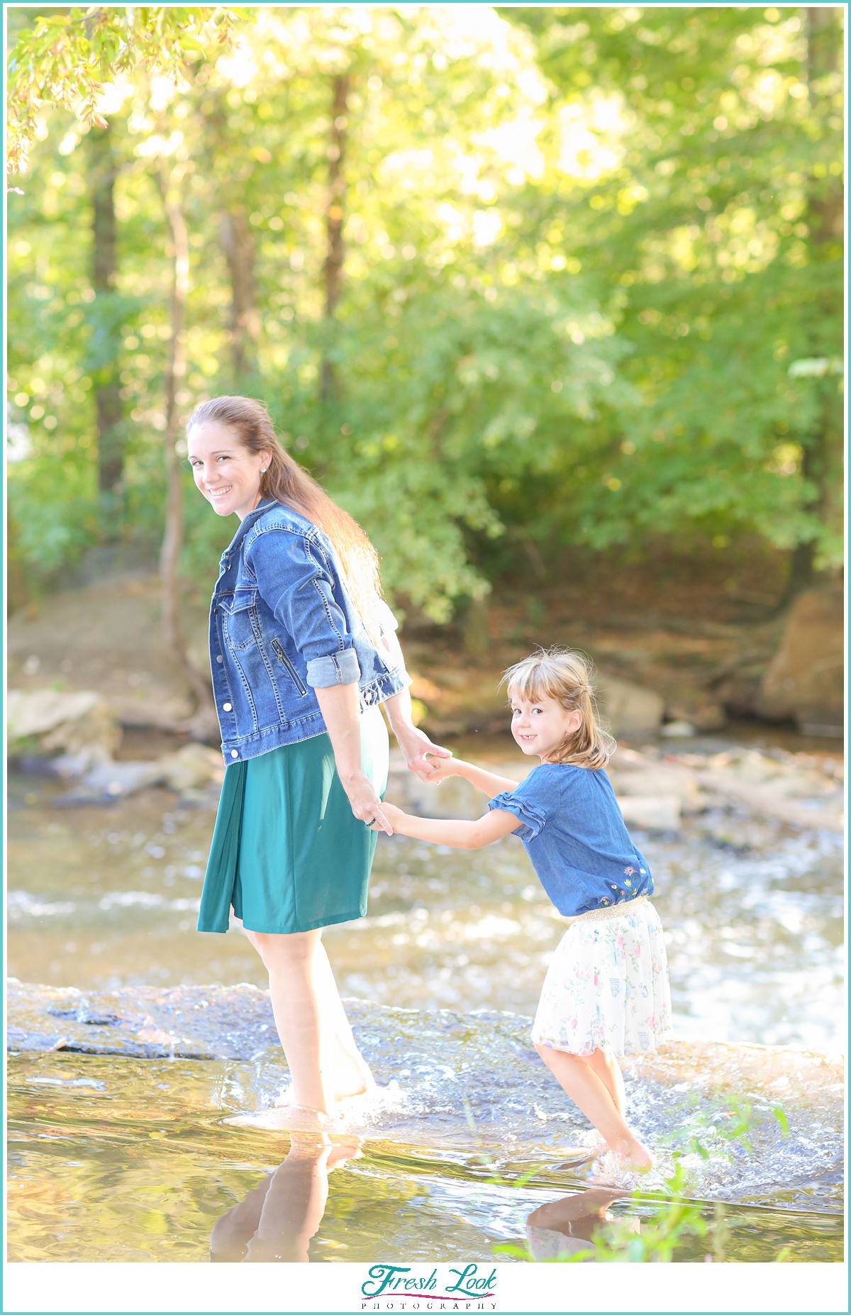 mother and daughter walking in the water