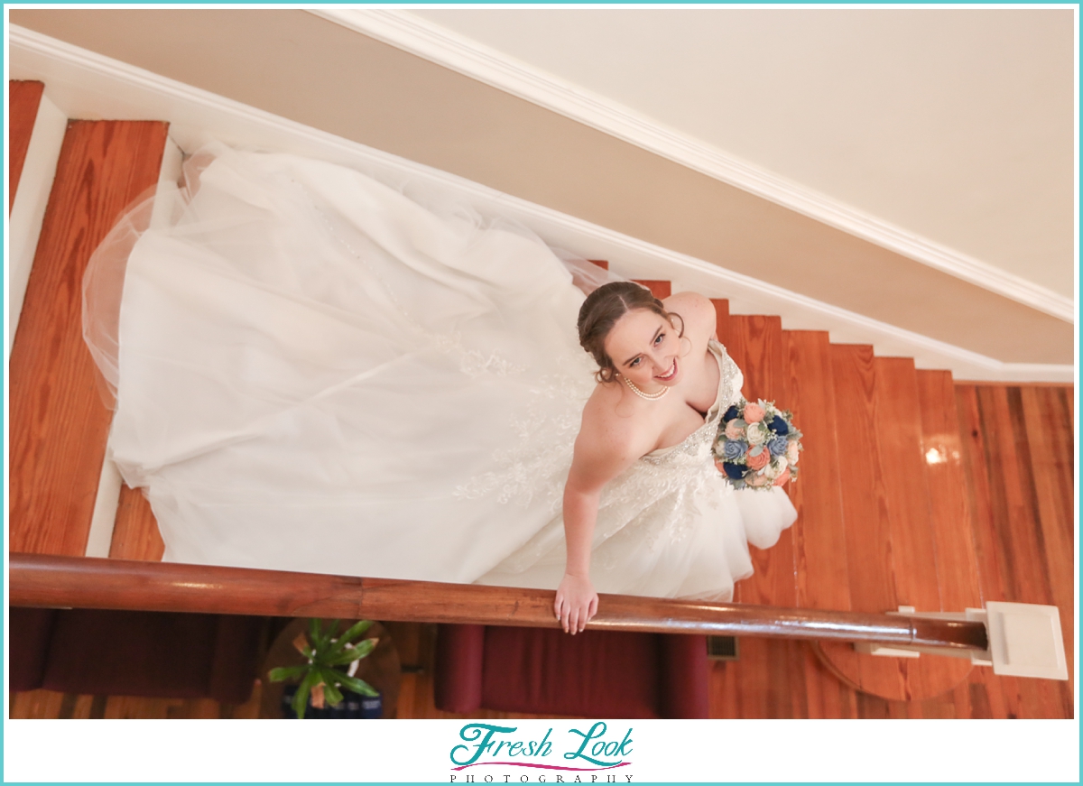 bride walking down the stairs on wedding day