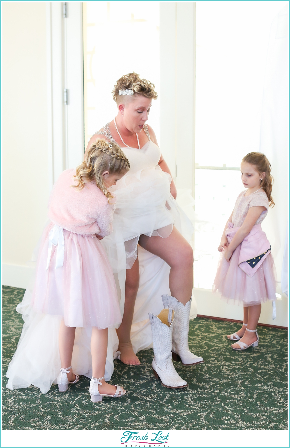 bride wearing cowboy boots at the wedding