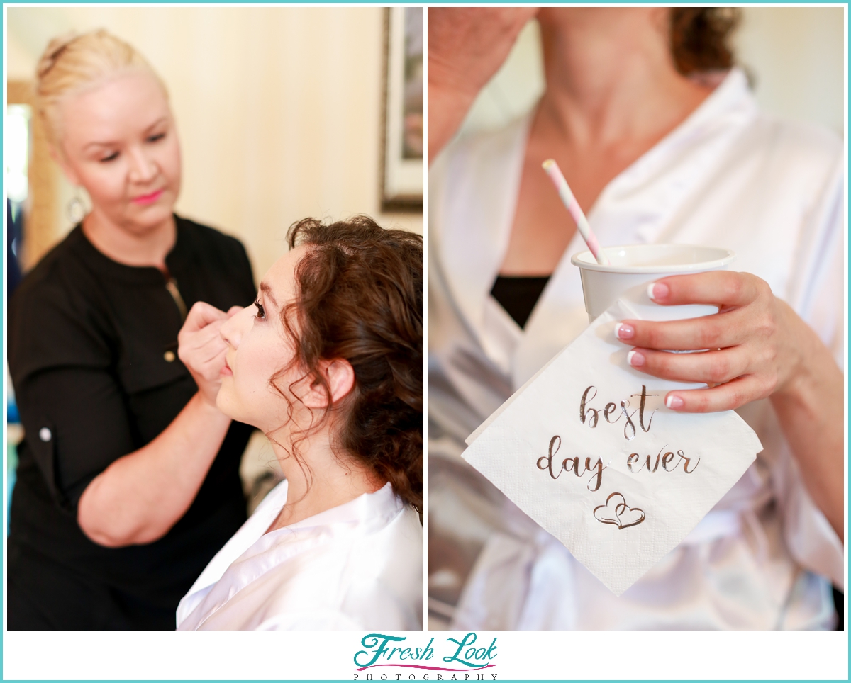 bride getting makeup done before the wedding