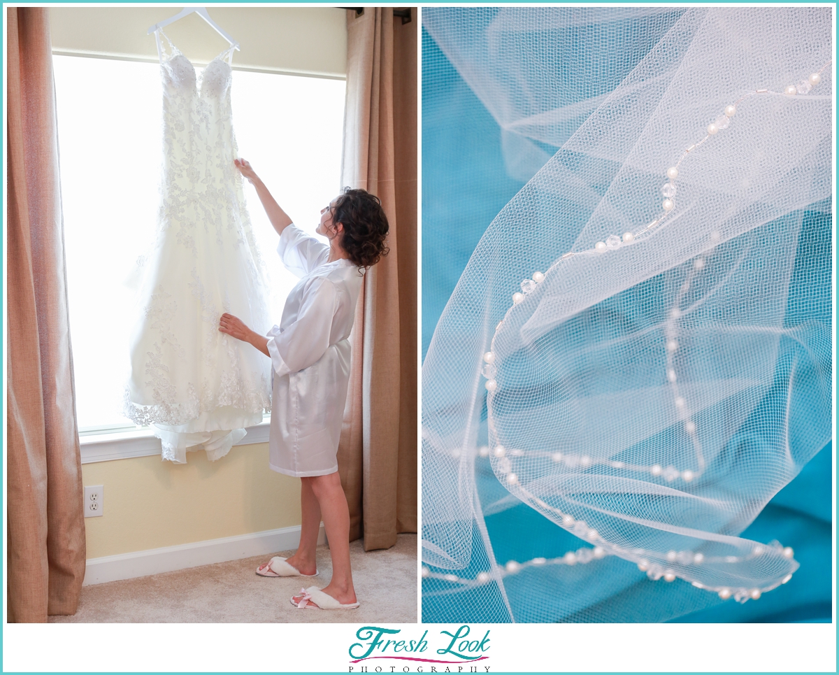 bride getting ready to put wedding dress on