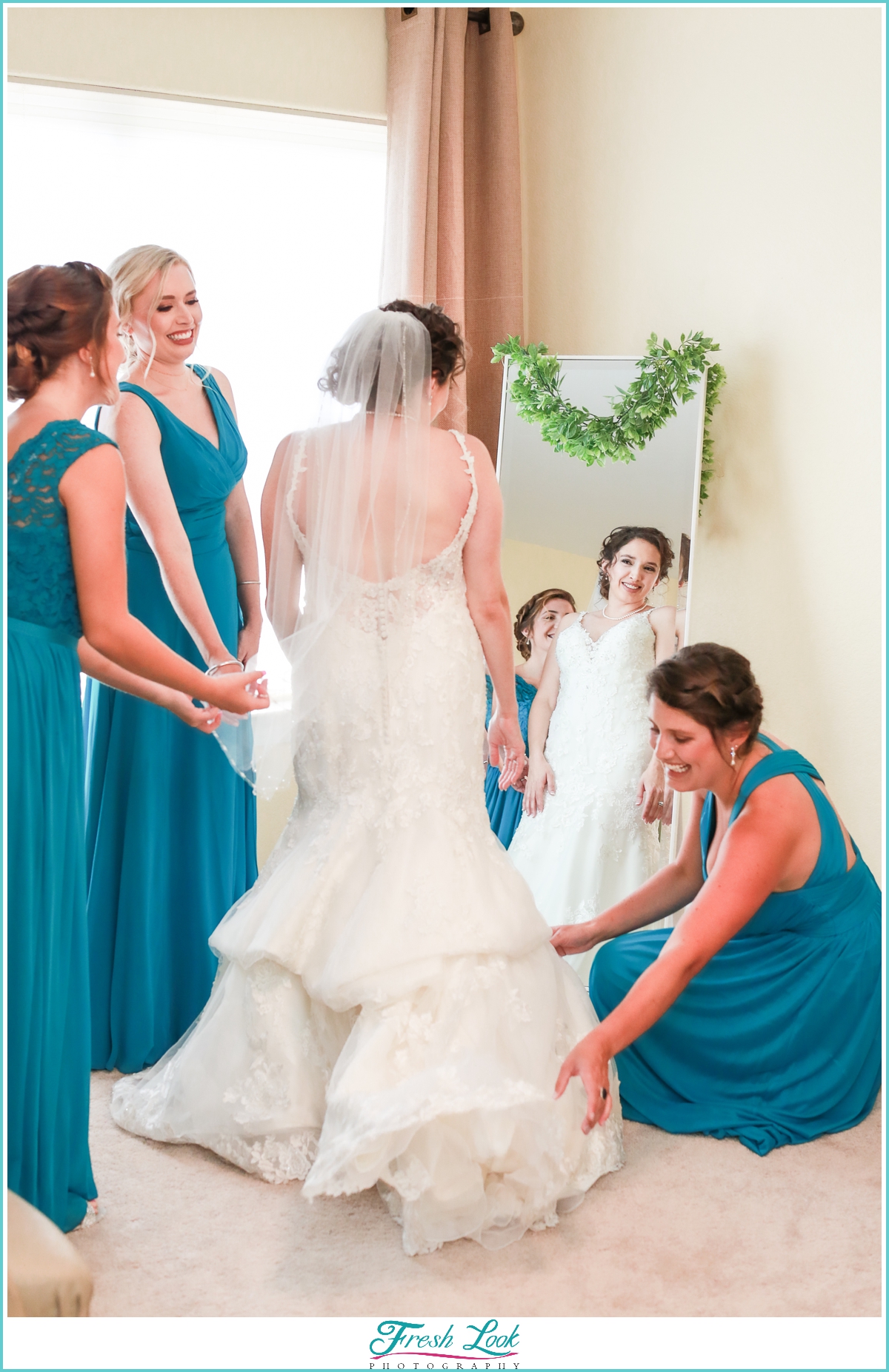 bride getting ready with bridesmaids