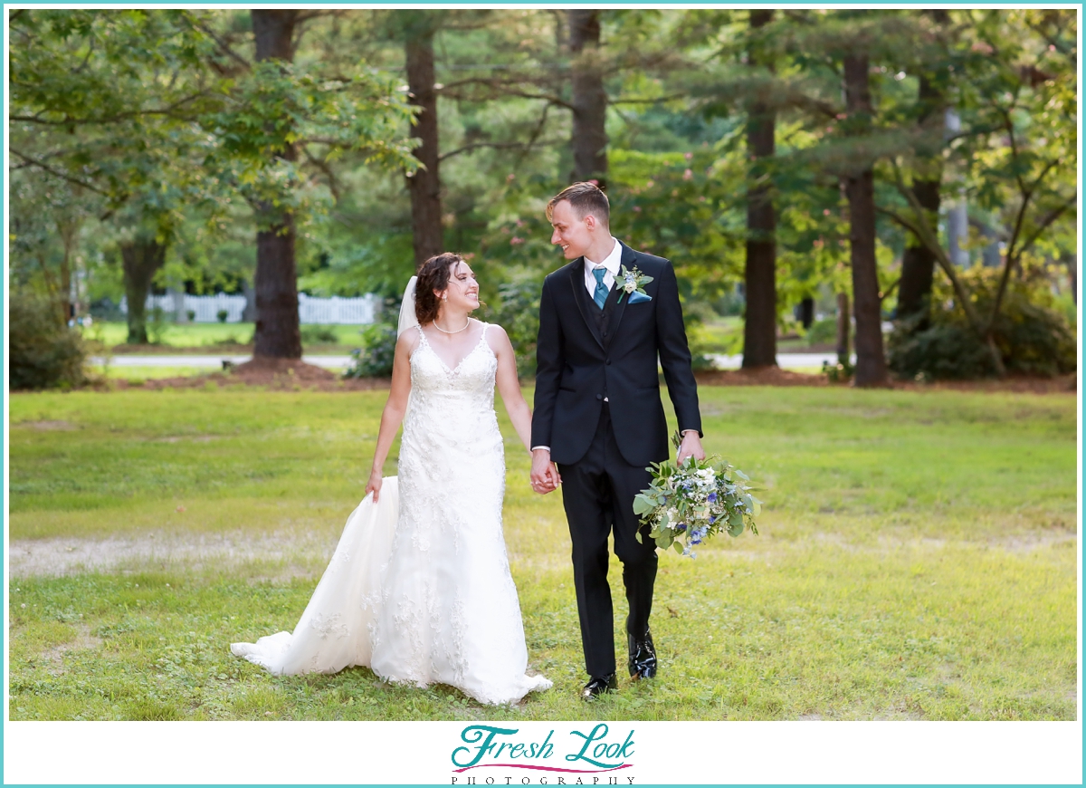 bride and groom walking hand in hand