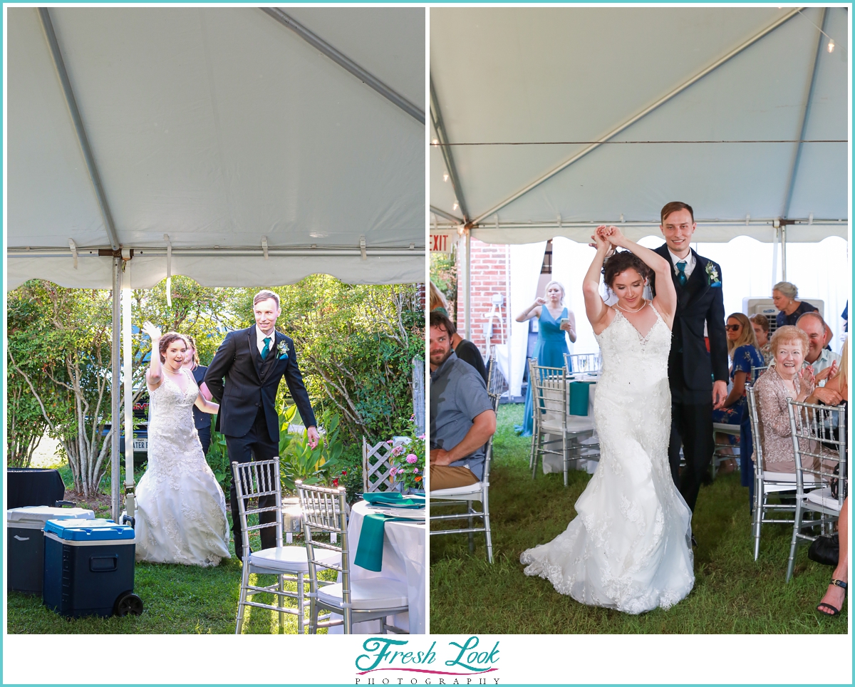 bride and groom entering reception