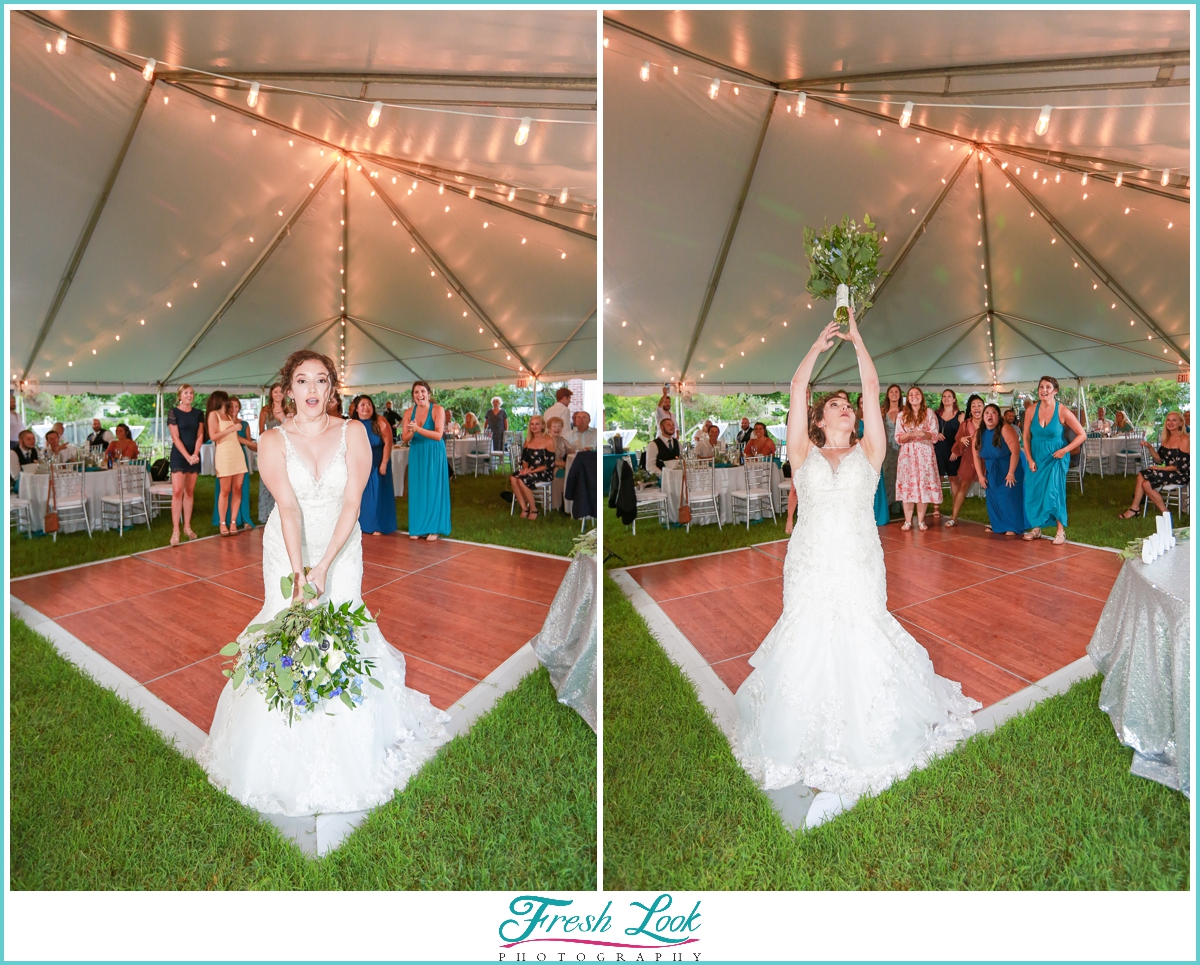 bride throwing bouquet at reception