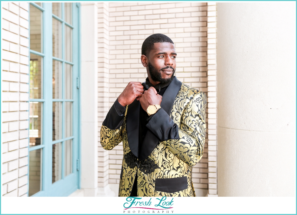 handsome groom wearing gold tuxedo