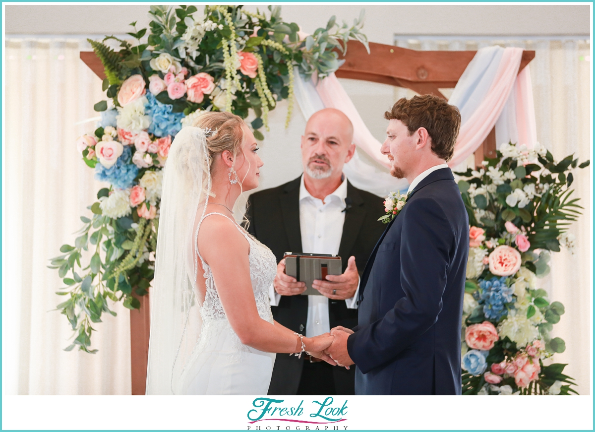 bride and groom exchanging vows