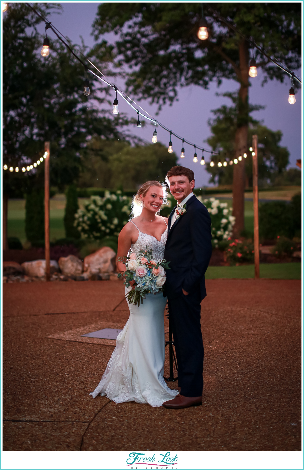 Bride and groom portraits with string lights