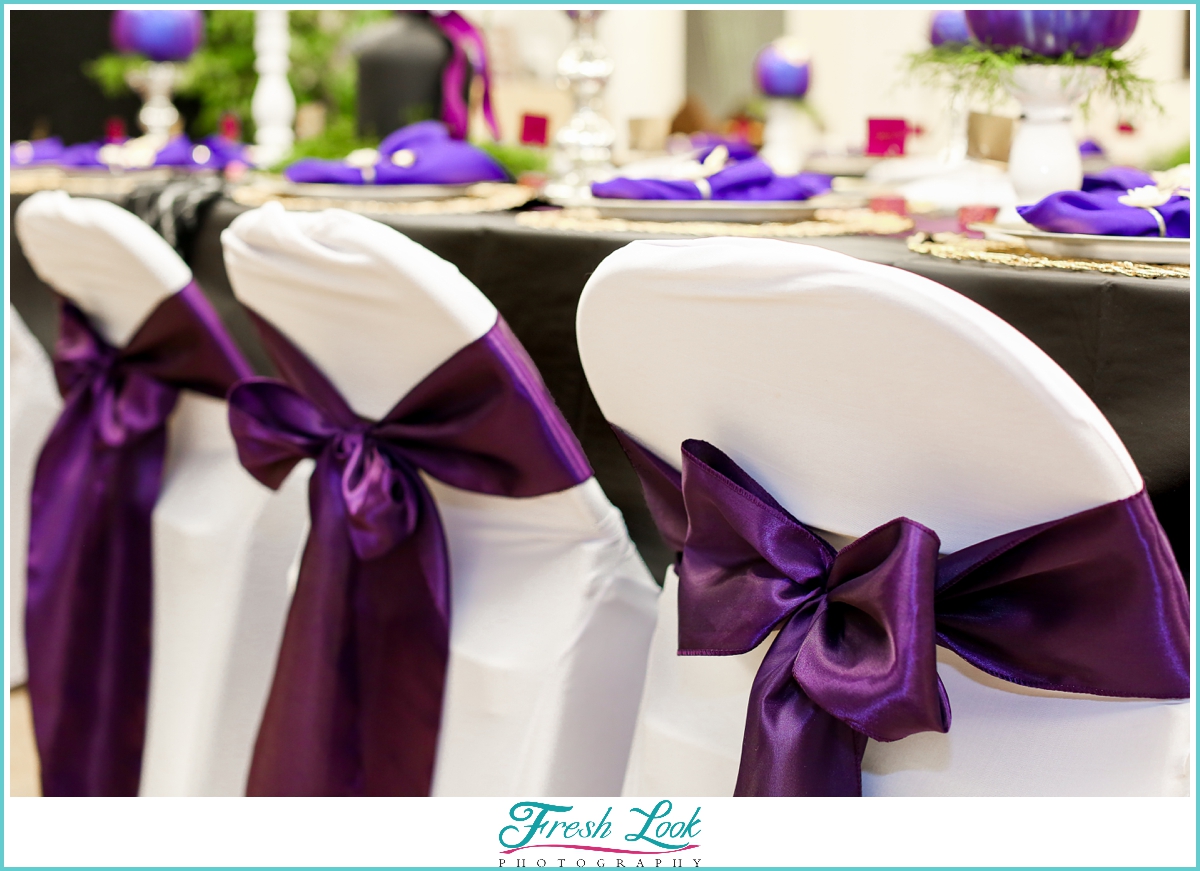 purple chair bows at reception