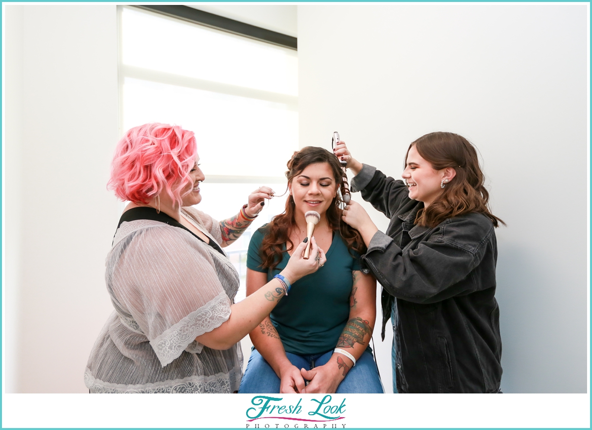 Makeup team getting bride ready