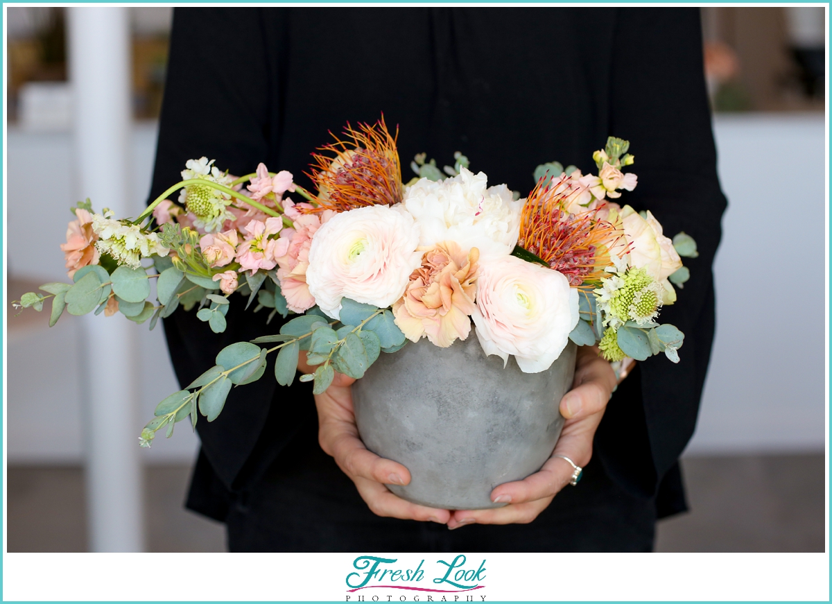 handmade bouquet in concrete vase