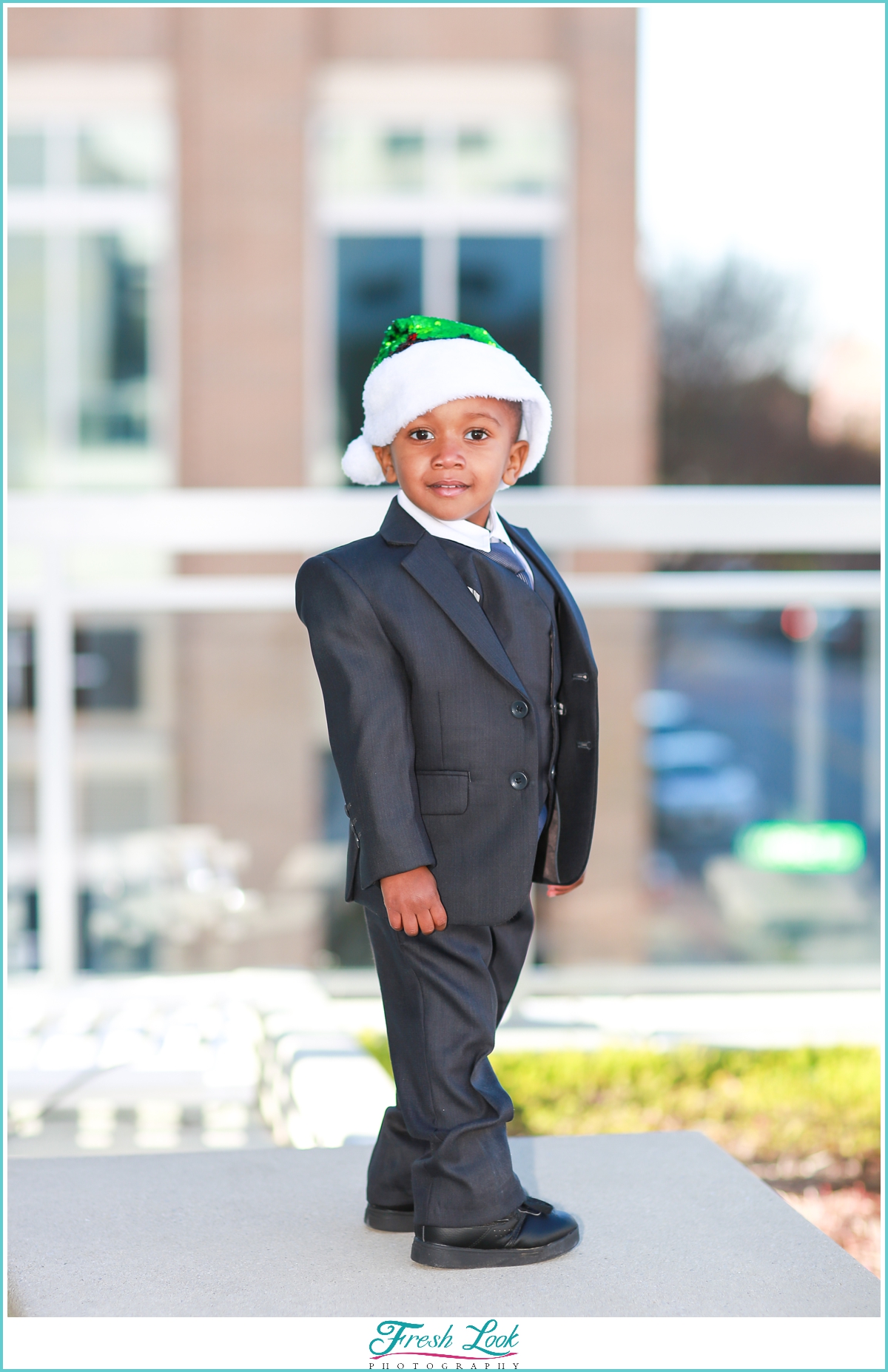 handsome little guy wearing Christmas hat