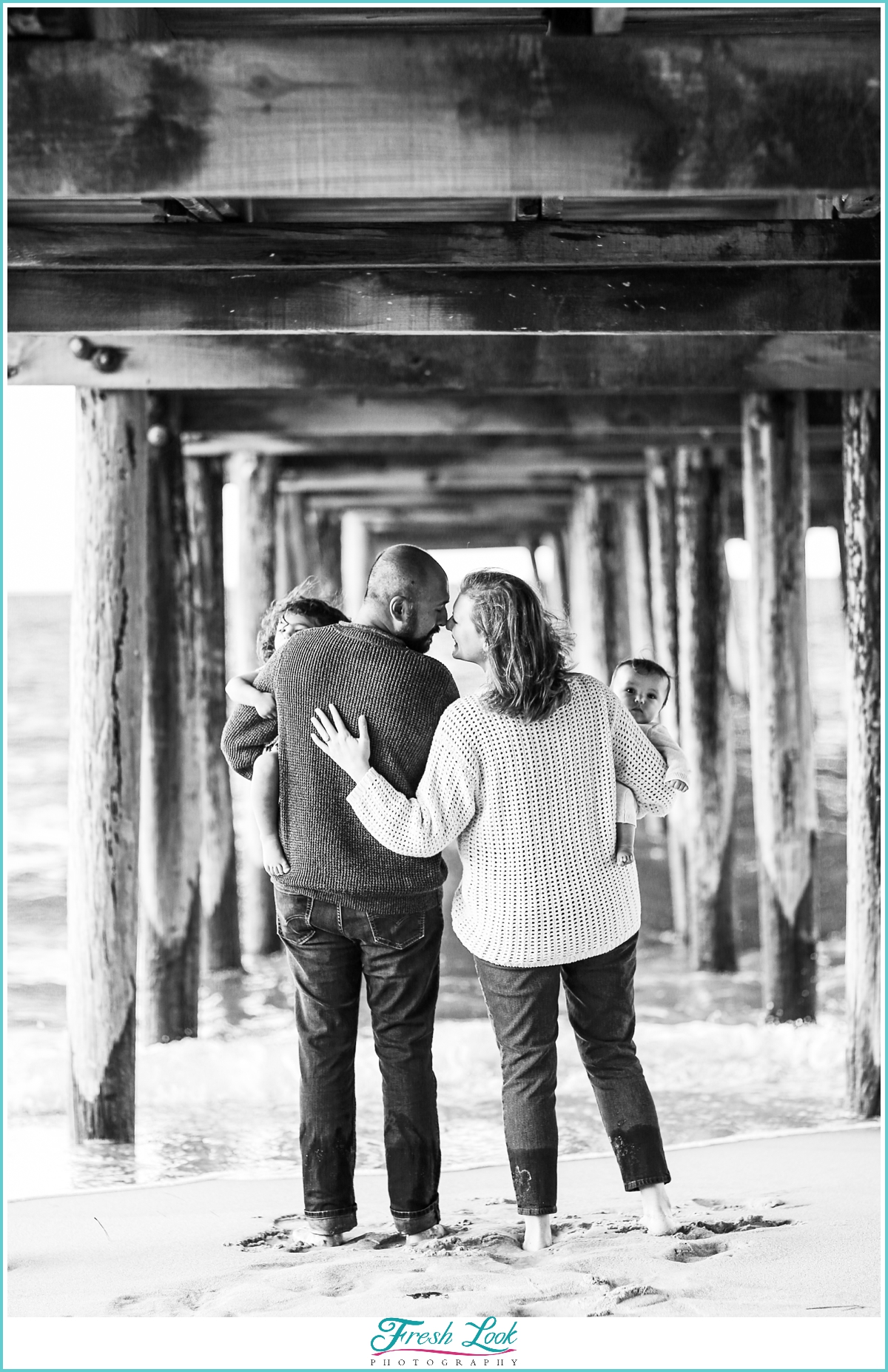 family photos under the pier