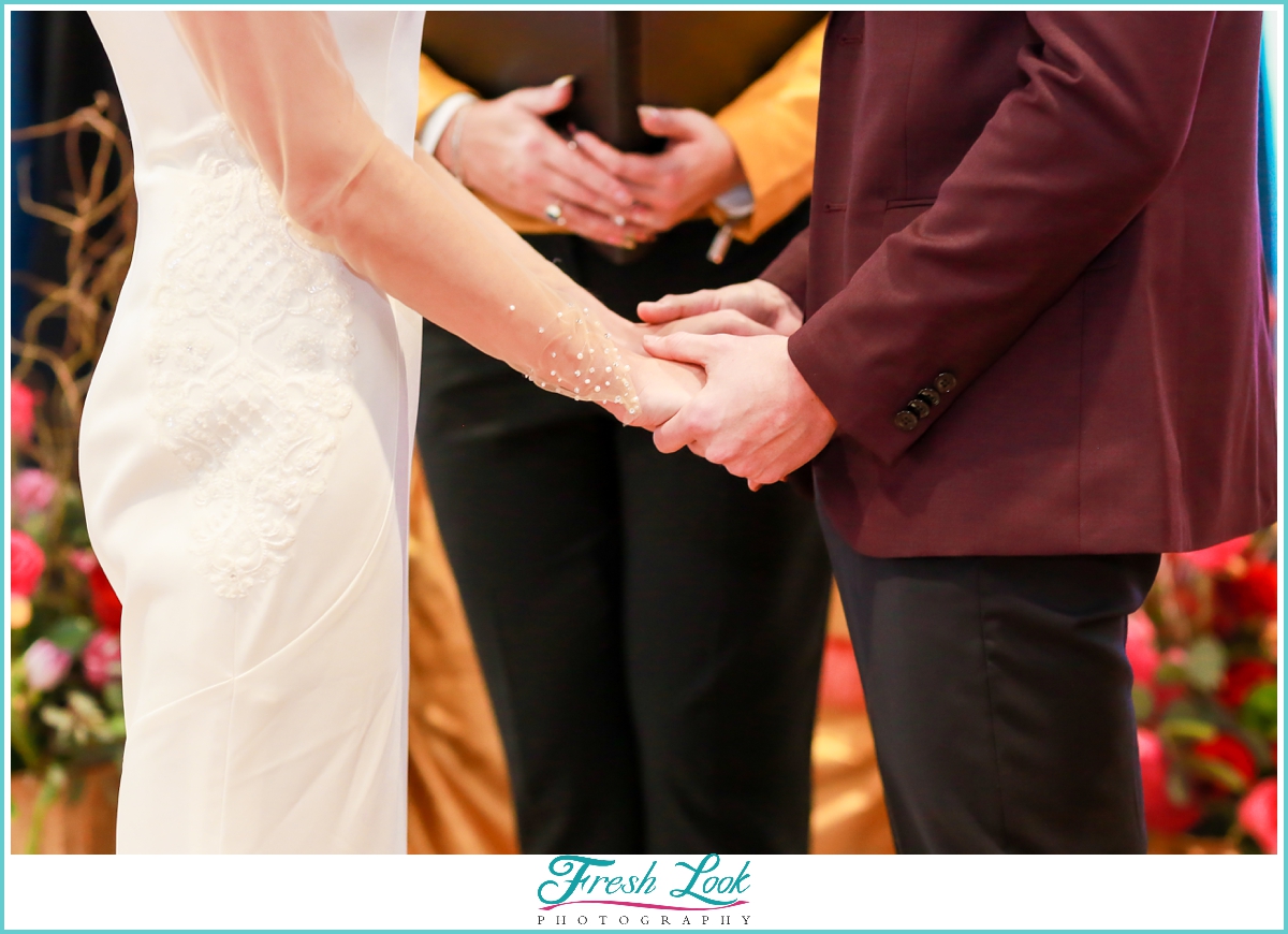 bride and groom exchanging vows at wedding ceremony