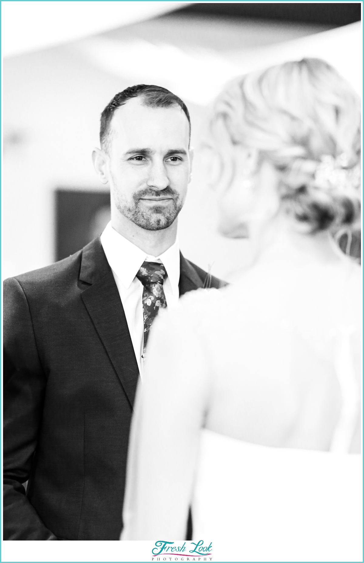 groom looking at his bride