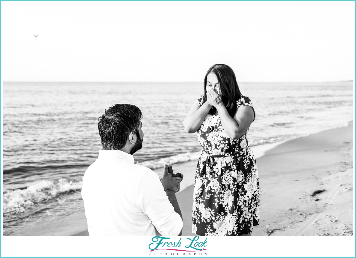 surprise proposal on the beach