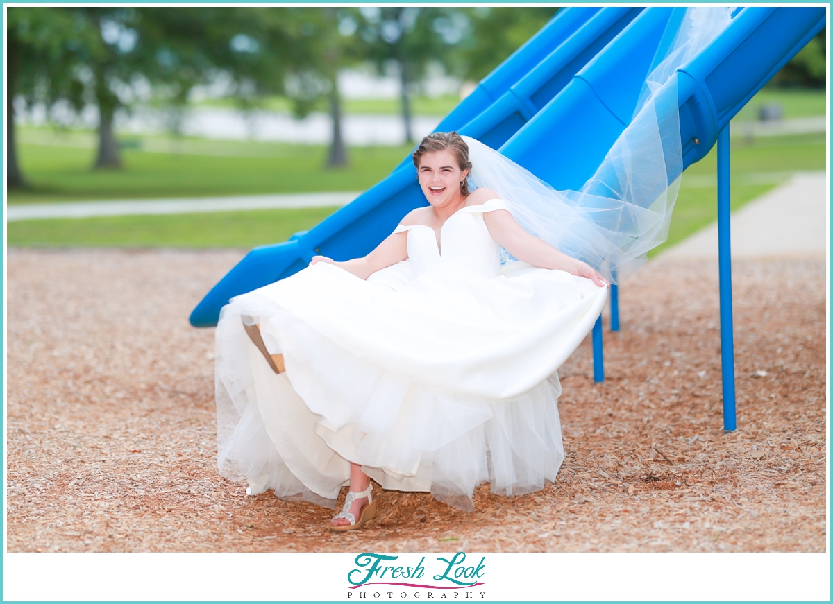 Bride sitting on the slide