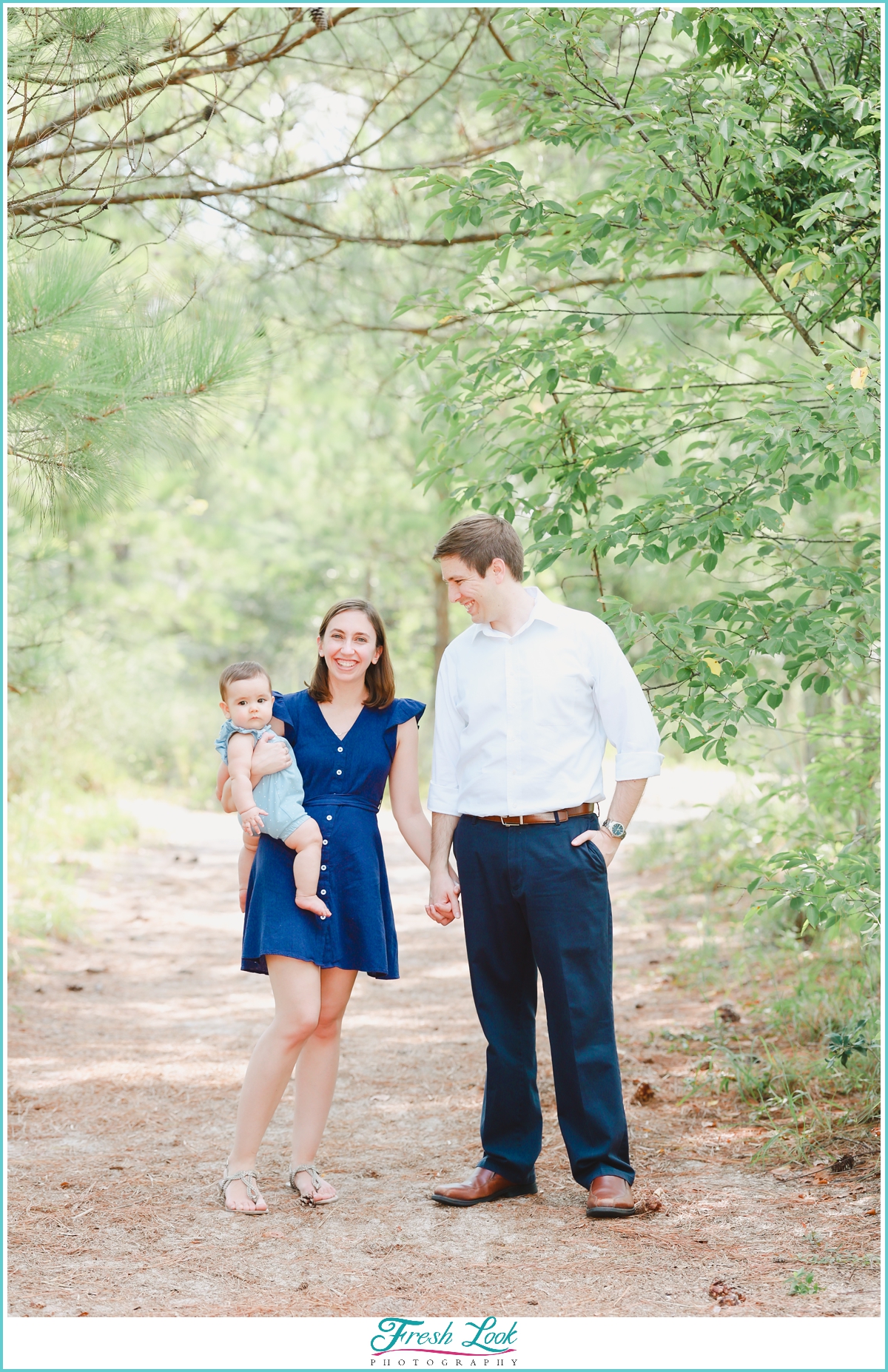 family of three photoshoot in the woods