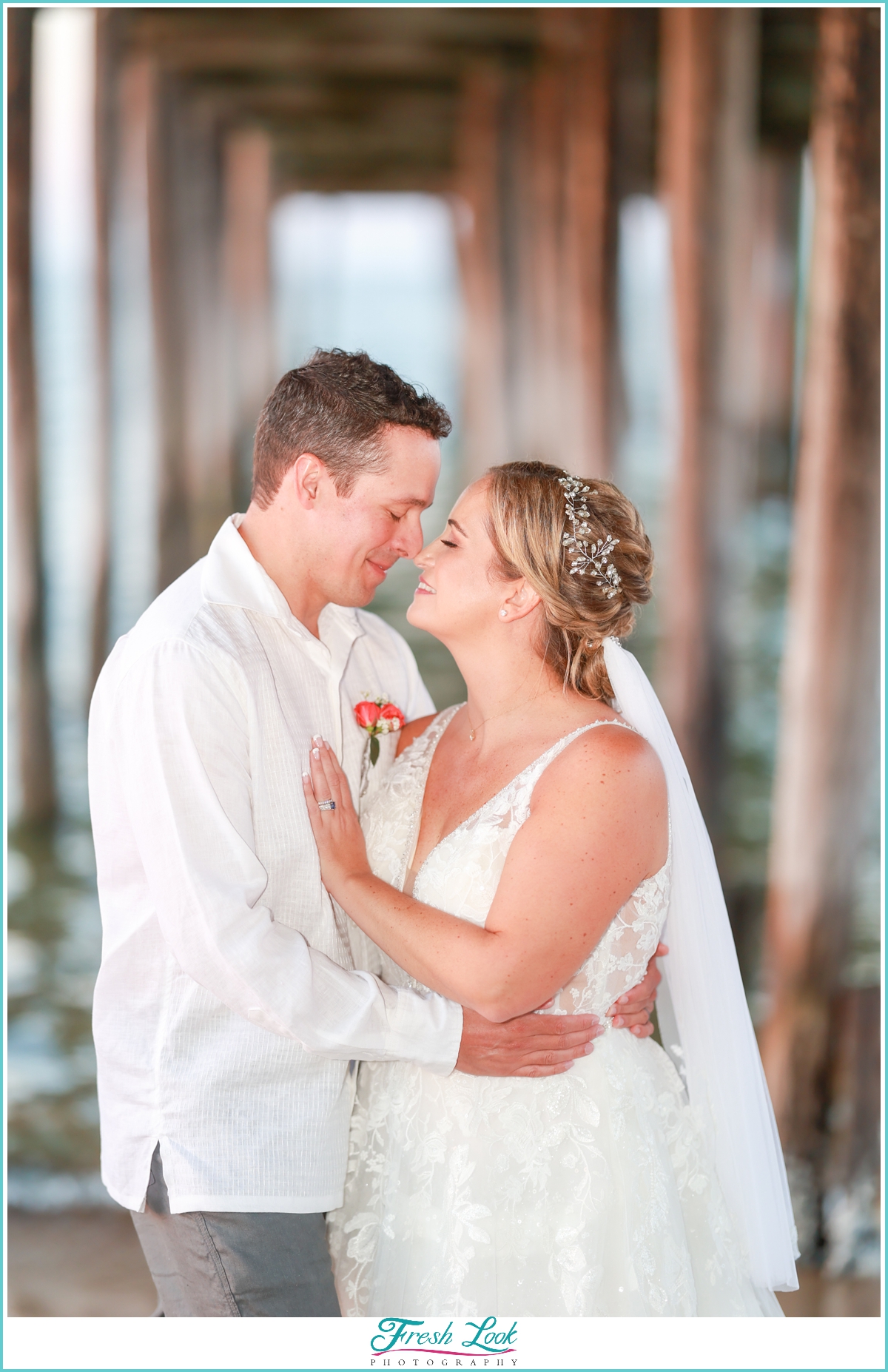 bride and groom beach pier portraits