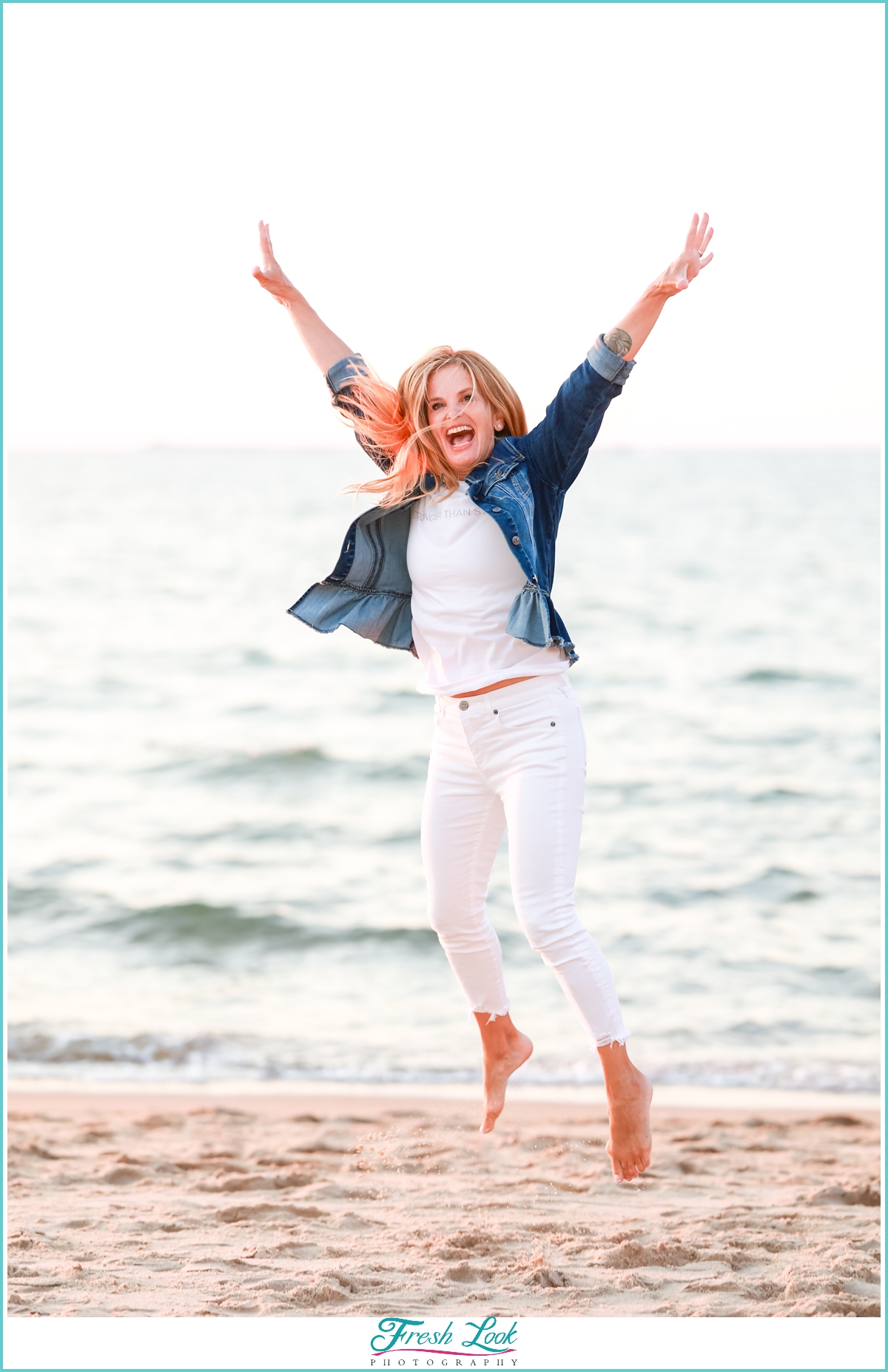 jumping for joy on the beach