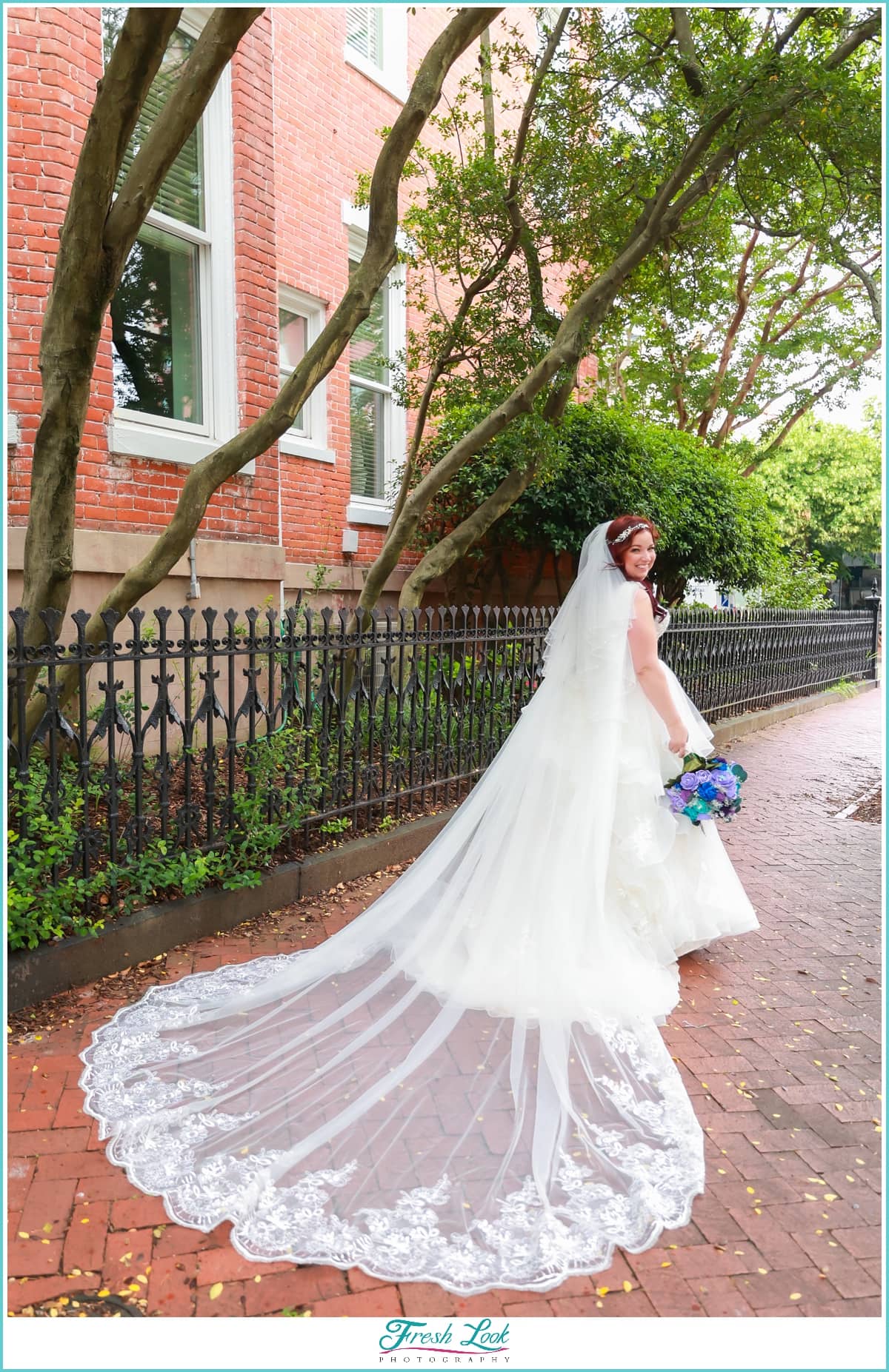 Bride with cathedral length wedding veil